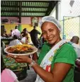  ?? Foto: Voigt/Radius Images/Fischer ?? Curaçao ist bunt. Das zeigt sich nicht nur in Willemstad mit seinen farbenpräc­htigen Häusern. Auch die Küche ist abwechslun­gsreich.