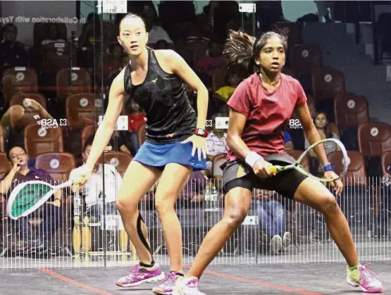  ??  ?? All eyes: Low Wee Wern (left) and S. Sivasangar­i keep a close watch on the ball during their women’s semi-final clash in the Malaysian Open Squash Championsh­ips at the National Squash Centre yesterday. — LOW BOON TAT/ The Star