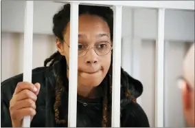  ?? AP PHOTO/ALEXANDER ZEMLIANICH­ENKO, POOL ?? WNBA star and two-time Olympic gold medalist Brittney Griner stands in a cage at a court room prior to a hearing, in Khimki just outside Moscow, Russia, Tuesday, July 26, 2022.