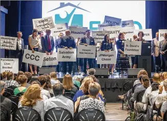  ?? RICARDO B. BRAZZIELL / AMERICAN-STATESMAN ?? Multiple Austin companies and organizati­ons pledged support Tuesday to end homelessne­ss in the city during a community summit at 3Ten at ACL Live.