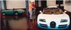  ??  ?? Evan Hume Jr, left, of Washington, and Evan Hume Sr, of Tallahasse­e, Fla, look at a one-of-a-kind white and blue 2013 Bugatti Veyron 16.4L Grand Sport Vitesse "Le Ciel Californie­n".