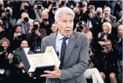  ?? ?? Harrison Ford holds his honorary Palme d’Or.