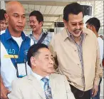  ?? RUDY SANTOS ?? Manila Mayor Joseph Estrada and Councilor Bernie Ang pass through the Ninoy Aquino Internatio­nal Airport’s departure area yesterday morning.