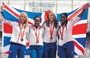  ??  ?? Britain’s Nicola Sanders, Marilyn Okoro, Kelly Sotherton and Christine Ohuruogu pose on the podium after being presented with their 2008 Olympic bronze medals