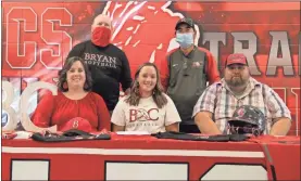  ?? Scott Herpst ?? LFO senior softball player Haley Stahl was joined by parents Melissa and Gary Stahl as she signed her letter of intent to play softball at Bryan College. Also on hand for the ceremony were Bryan head coach Mark Ritchhart and Bryan assistant coach Pete Massengale.