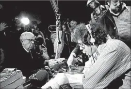  ?? Anthony Camerano Associated Press ?? PACIFICA was founded by pacifists in 1946. Above, Paul Fischer, right, of member station KPFA reads a letter from the Symbionese Liberation Army in 1974.