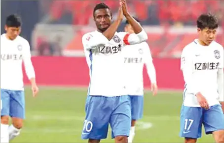  ??  ?? Mikel (centre) celebratin­g his first goal in the Chinese topflight... yesterday