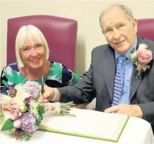  ??  ?? ●●Alfred Hulstone, 72, and long-term partner Val Heelam, also 72, were married on the ward at Stepping Hill Hospital