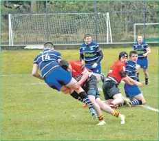  ??  ?? Arran’s Jack McNally performs a textbook takedown while his team mates look on