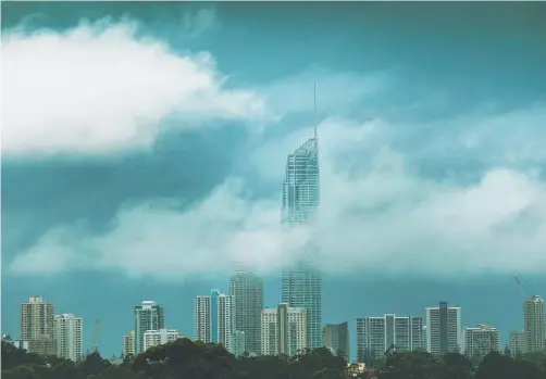  ??  ?? Glenn Hampson’s shot of the Q1 partially covered in cloud on a gloomy day is a finalist in the Regional News Photograph of the Year category.