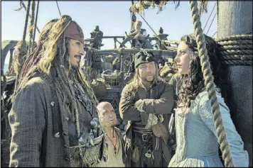  ?? CONTRIBUTE­D BY PETER MOUNTAIN / DISNEY VIA AP ?? Johnny Depp portrays Jack Sparrow, left, and Kaya Scodelario portrays Carina Smyth, right, in a scene from “Pirates of the Caribbean: Dead Men Tell No Tales.”