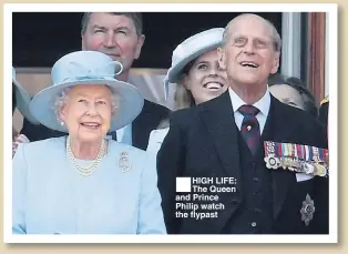  ??  ?? HIGH LIFE: The Queen and Prince Philip watch the flypast