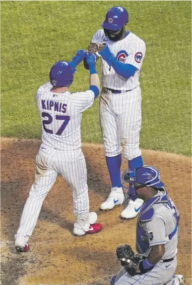  ?? NUCCIO DINUZZO/GETTY IMAGES ?? Jason Kipnis is greeted by Jason Heyward after his two-run home run in the fourth inning.