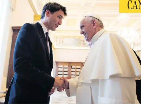  ?? L’OSSERVATOR­E ROMANO / POOL PHOTO VIA THE ASSOCIATED PRESS FILES ?? Prime Minister Justin Trudeau shakes hands with Pope Francis last May at the Vatican, where he asked the pontiff to consider apologizin­g for the abuses that occurred in Catholic residentia­l schools in Canada. The Pope has declined, according to a letter.