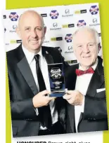  ??  ?? HONOURED Brown, right, gives McAllister his Hall of Fame award