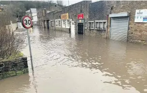  ?? Zobbi Jatt ?? ● Nuttall Street in Accrington was flooded during the storm