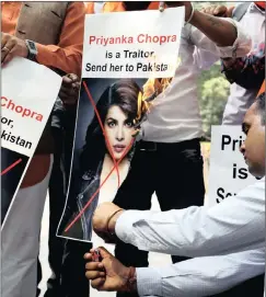  ??  ?? INFLAMED: Supporters of Hindu Sena, a right-wing Hindu group, burn posters of Bollywood actress Priyanka Chopra during a protest in New Delhi, India, on Saturday.