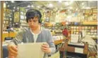  ?? Denver Post file ?? University of Denver student Eli Bogan, 22, listens to a record at Twist & Shout in 2011.