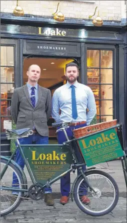  ??  ?? Business manager Mark Pegg and sales director Keiron Macnamara with the Loake bike