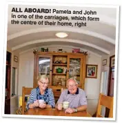 ??  ?? ALL ABOARD! Pamela and John in one of the carriages, which form the centre of their home, right