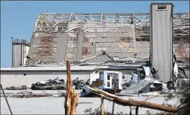  ?? JOE RAEDLE / GETTY IMAGES ?? A damaged airplane hanger can be seen on the grounds of Tyndall Air Force Base after Hurricane Michael passed through Mexico Beach, Florida, this week. The hurricane hit the area packing category 4 winds and caused major damage.