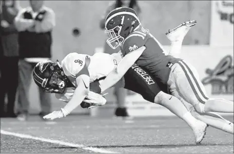  ?? Michael Owen Baker For The Times ?? RECEIVER JAKE BAILEY of St. John Bosco falls into the end zone as he is tackled by Mater Dei’s Joshua Hunter during the first half.