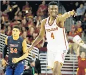  ?? Chris Carlson Associated Press ?? CHIMEZIE METU celebrates after scoring in his 18-point performanc­e against Cal State Fullerton.