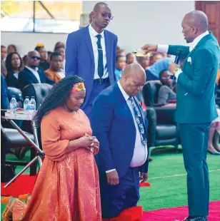  ?? ?? Prophet Chiza (right) pours oil on politician Job Sikhala in Bulawayo recently