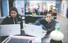  ?? BEA AHBECK/NEWS-SENTINEL ?? Students Mayra Rebolledo and Karina Barron, both 16, do homework at Rio Valley Charter School in Lodi on Wednesday.