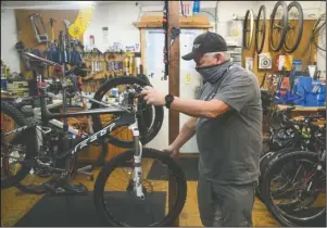  ?? The Sentinel-Record/Grace Brown ?? BIKE SHOP: Bruce Hubbard of Parkside Cycle, 719 Whittingto­n Ave., gives a tour of his bike shop on Tuesday.