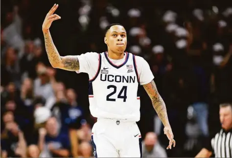  ?? Jessica Hill / Associated Press ?? UConn’s Jordan Hawkins (24) reacts after making a basket against Oklahoma State on Thursday in Storrs.