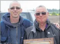  ??  ?? Mark Becher, who runs the group, with Paul Wood after he was given an award by fellow members. Right, the gold ring thought to be crest of a rich family in the 1500s