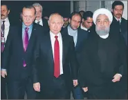  ?? AP/MIKHAIL KLIMENTYEV ?? Russian President Vladimir Putin (center), flanked by Turkish President Recep Tayyip Erdogan (left) and Iranian President Hassan Rouhani, leave a news conference Wednesday in the Black Sea port of Sochi, Russia.