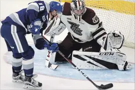  ?? CLIFFORD SKARSTEDT EXAMINER ?? Peterborou­gh Petes goalie Hunter Jones closes the door on Sudbury Wolves’ Owen Robinson during second period OHL action on Thursday at the Memorial Centre.