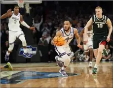  ?? FRANK FRANKLIN II — THE ASSOCIATED PRESS ?? Kansas State guard Markquis Nowell steals the ball from Michigan State forward Malik Hall in overtime of a Sweet 16game in the East Regional of the NCAA Tournament at Madison Square Garden in New York.