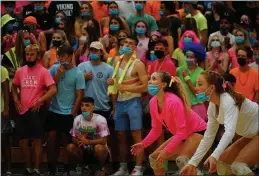  ?? PHOTOS BY DAN REIDEL — ENTERPRISE-RECORD ?? The Pleasant Valley student section and volleyball players Kendal Thau (1) and Kenna Chapin (3) wait for the serve in a rivalry game Wednesday at Varley Gym in Chico.