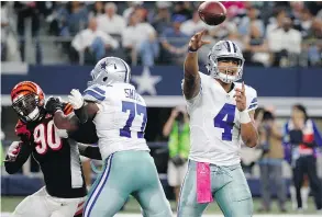  ??  ?? Dallas Cowboys quarterbac­k Dak Prescott led his team to a fourth consecutiv­e victory Sunday, a 28-14 defeat of the Cincinnati Bengals. The rookie QB has not thrown an intercepti­on in 155 pass attempts.