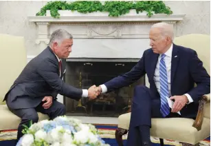  ?? (Jonathan Ernst/Reuters) ?? US PRESIDENT Joe Biden and Jordan’s King Abdullah shake hands in the White House on Monday.