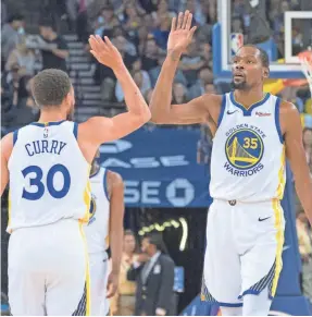  ?? KYLE TERADA/USA TODAY SPORTS ?? Forward Kevin Durant and guard Stephen Curry are two of five All-Stars on the Warriors, who are chasing their third title in a row.