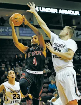  ?? ERIC DRAPER/ASSOCIATED PRESS FILE PHOTO ?? New Mexico State’s Ian Baker drives to the basket between Northern New Mexico defenders Nicho Burgard, right, and Eric Coca in January during a game in Rio Rancho. Northern will play road games at NMSU and The University of New Mexico next season.