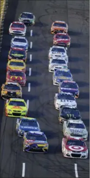  ?? MIKE MCCARN — THE ASSOCIATED PRESS ?? Kyle Larson, front right, and Kyle Busch, from left, lead the field at the start of the NASCAR All-Star race on May 20 at Charlotte Motor Speedway.