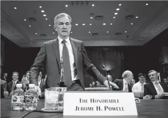  ?? Win McNamee / Getty Images ?? Federal Reserve Board Chairman Jerome Powell arrives for testimony Thursday before the Senate Banking, Housing and Urban Affairs Committee.