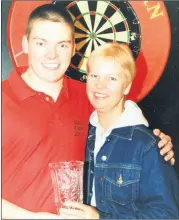  ?? ?? Trevor McGahern a member of the Mac’s Bar, Fermoy Darts team, that won the Murphy’s Shield in 2002, being congratula­ted by his mother, Joan.