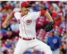  ?? JOHN MINCHILLO / AP ?? The Reds’ Asher Wojciechow­ski got the start Wednesday night at home against the Cubs but didn’t last long. He gave up eight runs (seven earned ) and walked three in 32/3 innings.