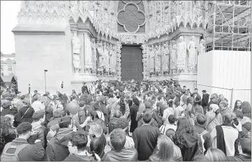  ?? — Reuters photo ?? Young people gather in front of the main entrance during the visit Le Pen and Debout La France group former candidate Nicolas Dupont-Aignan at the Cathedral in Reims, France.