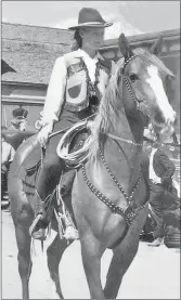  ??  ?? Taken in 1944, Bessie Vroom leading the Pincher Creek Fair and Rodeo Parade.