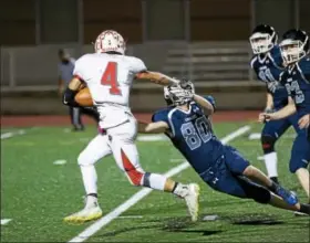  ?? DENNIS KRUMANOCKE­R - FOR DFM ?? Fleetwood’s Mike Wilkinson fights of a Kutztown tackler on his way to one of four touchdowns Friday.