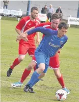  ??  ?? On the ball Darren Neave in action