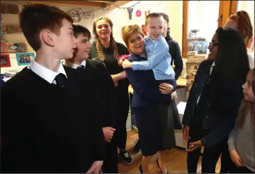  ??  ?? First Minister Nicola Sturgeon with six-year-old Angus Armstrong at the launch of a new young carers grant