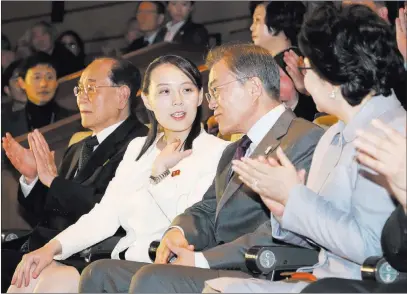  ?? Bee Jae-man ?? The Associated Press South Korean President Moon Jae-in talks with Kim Yo Jong, North Korean leader Kim Jong Un’s sister, as they watch a performanc­e Sunday of North Korea’s Samjiyon Orchestra at National Theater in Seoul, South Korea.